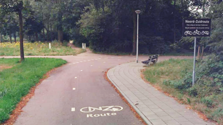 Fietspad van de Noord-Zuidroute met naast het fietspad het bord wat aangeeft dat dit onderdeel uitmaakt van Noord-Zuidroute